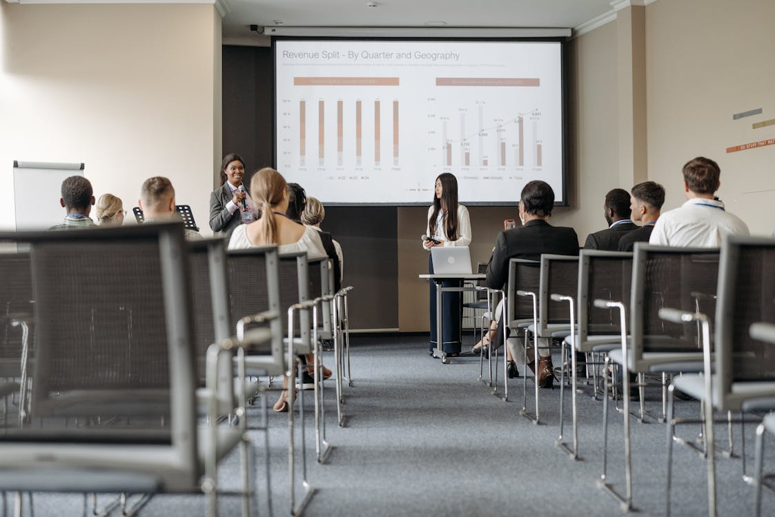 Audience watching a presentation at an indoor venue